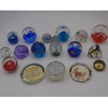 A collection of seventeen glass paperweights including a Caithness.