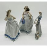 Three Nao figurines in the form of ladies