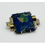An unmarked gold (believed to be 18ct) Art Deco brooch set with Lapis Lazuli and diamonds, makers