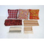 A quantity of vintage Norwegian table runners along with tapestried cushions and fabrics etc.