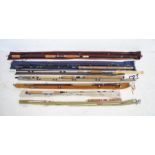 A collection of mainly antique salmon fishing rods with cases including one custom hand-built rod