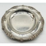 A Victorian hallmarked silver salver/plate by Garrards, London with engraved crest depicting a