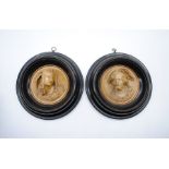 A pair of Victorian relief busts of classical figures - diameter 21cm