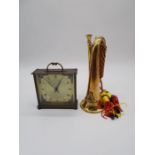 A copper and brass bugle with the Royal Artillery crest, plus an eight day floating balance clock by