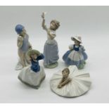 A collection of five Nao figurines all in the form of young girls