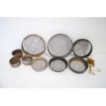 A quantity of garden sieves along with an antique garden string winder