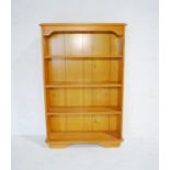 A pine freestanding bookcase - length 86cm, depth 29cm, height 131cm