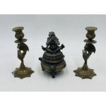 A 20th century Chinese bronze incense burner, along with a pair of Eastern candlesticks