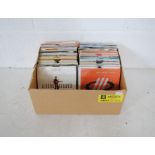 A collection of 7" vinyl records consisting of mainly 80s music including Ultravox, Echo and The