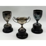 Three small hallmarked silver trophies on stands