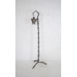 An ornate wrought iron standard lamp - height 199cm