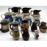 A large collection of mainly stoneware jugs including Denby, Doulton etc.