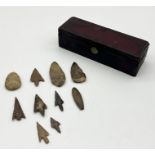 A collection of flint arrow heads (possibly Neolithic?) along with a leather stationary box made