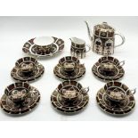 A Royal Crown Derby Imari pattern 1128 tea set consisting of six trios, teapot, milk jug and