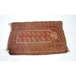 An Eastern red ground prayer rug (A/F) - 140cm x 86cm