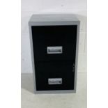 A small metal two drawer filing cabinet