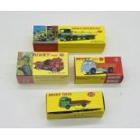 Three boxed modern Atlas Mattel Dinky Toys die-cast vehicles including a Bedford TK Tipper (435),