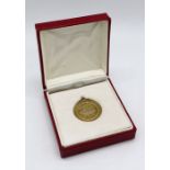 A 9ct gold "Old Spice" medallion, total weight 13.8g