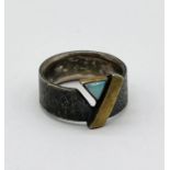 A 925 hammered silver ring set with an opal
