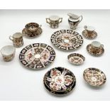 A collection of Royal Crown Derby china including Imari pattern (1128) cup, saucer and loving cup,