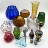 A collection of various art glass including oversized glasses, vases, blue glass gilt decanter and