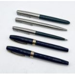 A collection of vintage pens including Parker and Sheaffer's