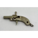 A miniature pin fired pistol - overall length 4cm