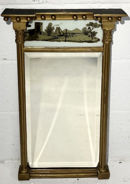 A Georgian gilt mirror with reverse painted panel to top showing a maritime scene 68cm x 35cm