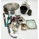A collection of miscellaneous items including musical bird in cage, silver plated items, various