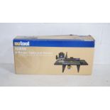 A boxed Nutool 1200W router table and router, complete with 20 piece 1/4" (6.35mm) router bit set