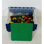 A box of Duplo including building block, vehicles, figures etc