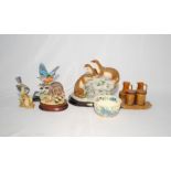 A 'Juliano Collection' figure group of otters, along with a kingfisher, racoon and other ceramics