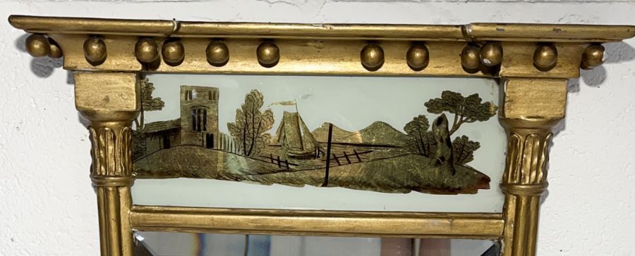 A Georgian gilt mirror with reverse painted panel to top showing a maritime scene 68cm x 35cm - Image 2 of 5
