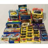A collection of boxed die-cast vehicles including Matchbox Superfast, Majorette Cadburys Collection,