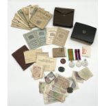 A collection of various war and military ephemera including ration books, soldier's book, two WW2