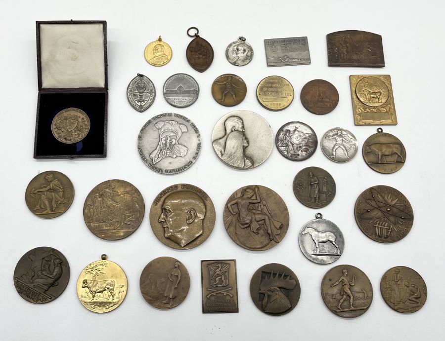 A collection of various 19th century tokens and medallions including a number of French examples