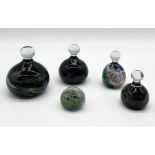 A collection of five Mdina glass paperweights