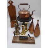 An assortment of vintage items including candlesticks, shoe lasts, candle wall holder, a desk