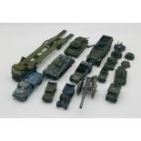 A collection of vintage play worn military die-cast vehicles including Dinky Toys, Britains, Lone