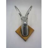 A mounted brushed aluminium Ibex (mountain goat) head.