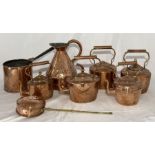 A collection of copper including a gallon jug, five kettles etc.