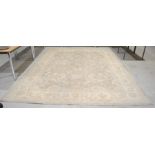 A large beige ground eastern rug - 362cm x 278cm