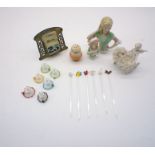 An assortment of vintage items including half dolls and nine blown glass stir sticks in the form