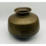 An Eastern brass bowl - height approx. 32cm