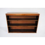 A mahogany freestanding bookcase - length 142cm, depth 30cm, height 97cm