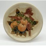 A Moorcroft cream ground dish with Finches motif, stamp to back - 26cm diameter