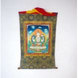 A hand painted Tibetan wall hanging depicting Avalokitesvera (Buddha of compassion).