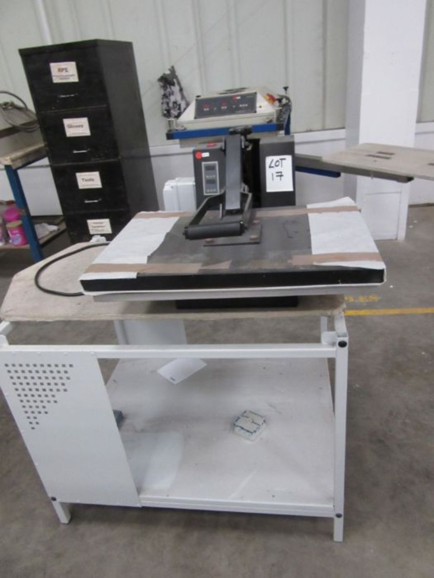 A heat press machine on stand