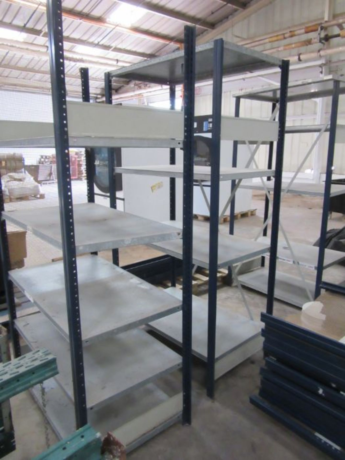 Three sets of industrial metal racking