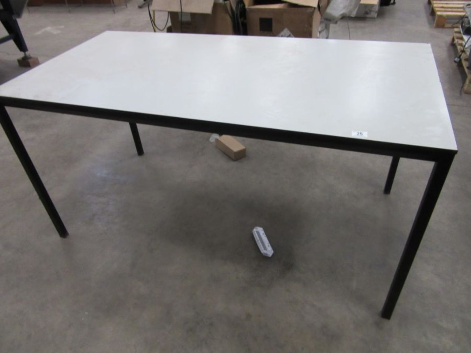 An industrial metal framed work table